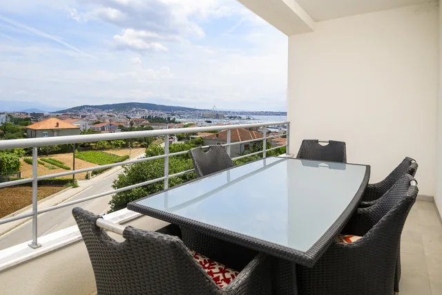 Private balcony with an outdoor dining table