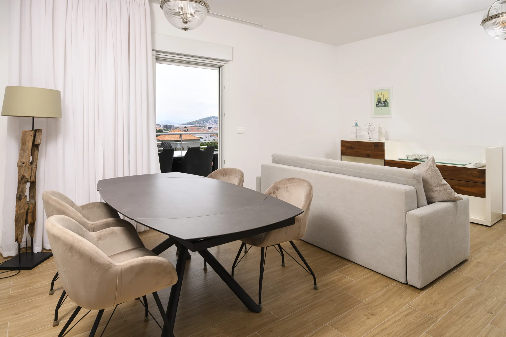 Apartment A living and dining room, with balcony access
