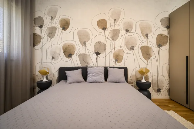 First bedroom with a botanical feature wall
