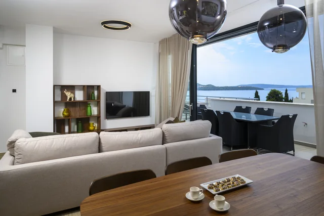 Penthouse living room opening onto the sea-view terrace