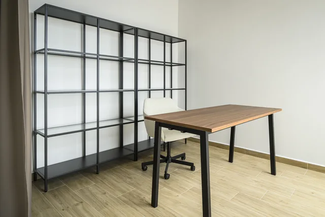 Home office desk, office chair and open shelving