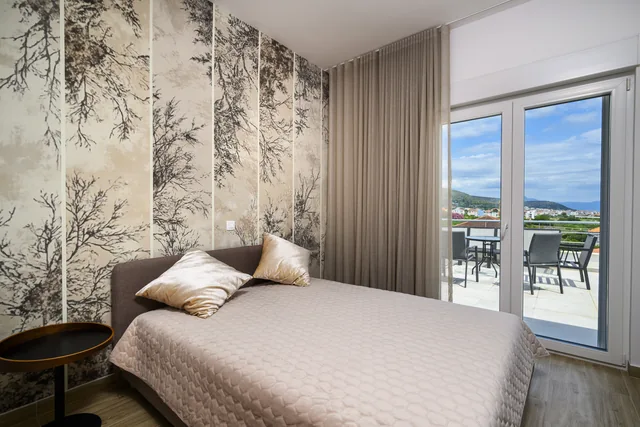 Second penthouse bedroom opening onto a terrace
