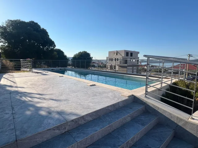 Shared swimming pool and surrounding terrace