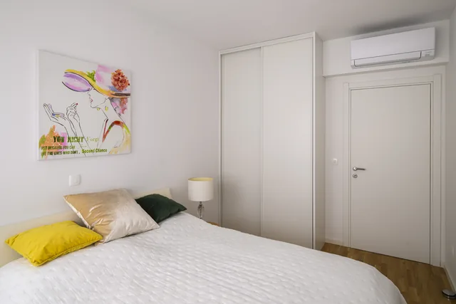 Second bedroom with a wardrobe and an interior door