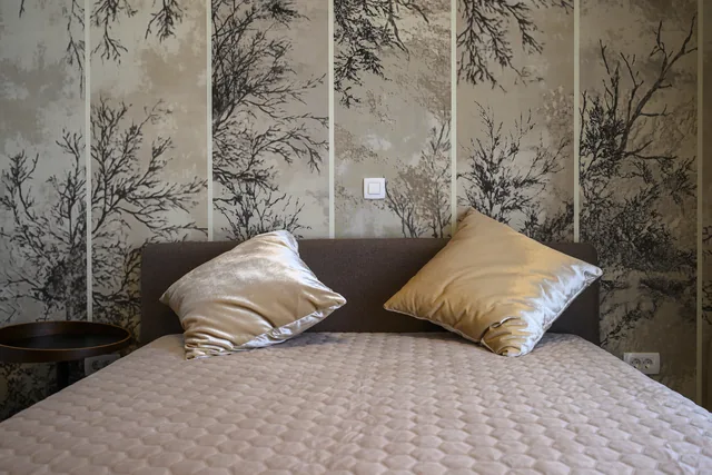 Second bedroom bedding and woodland feature wall